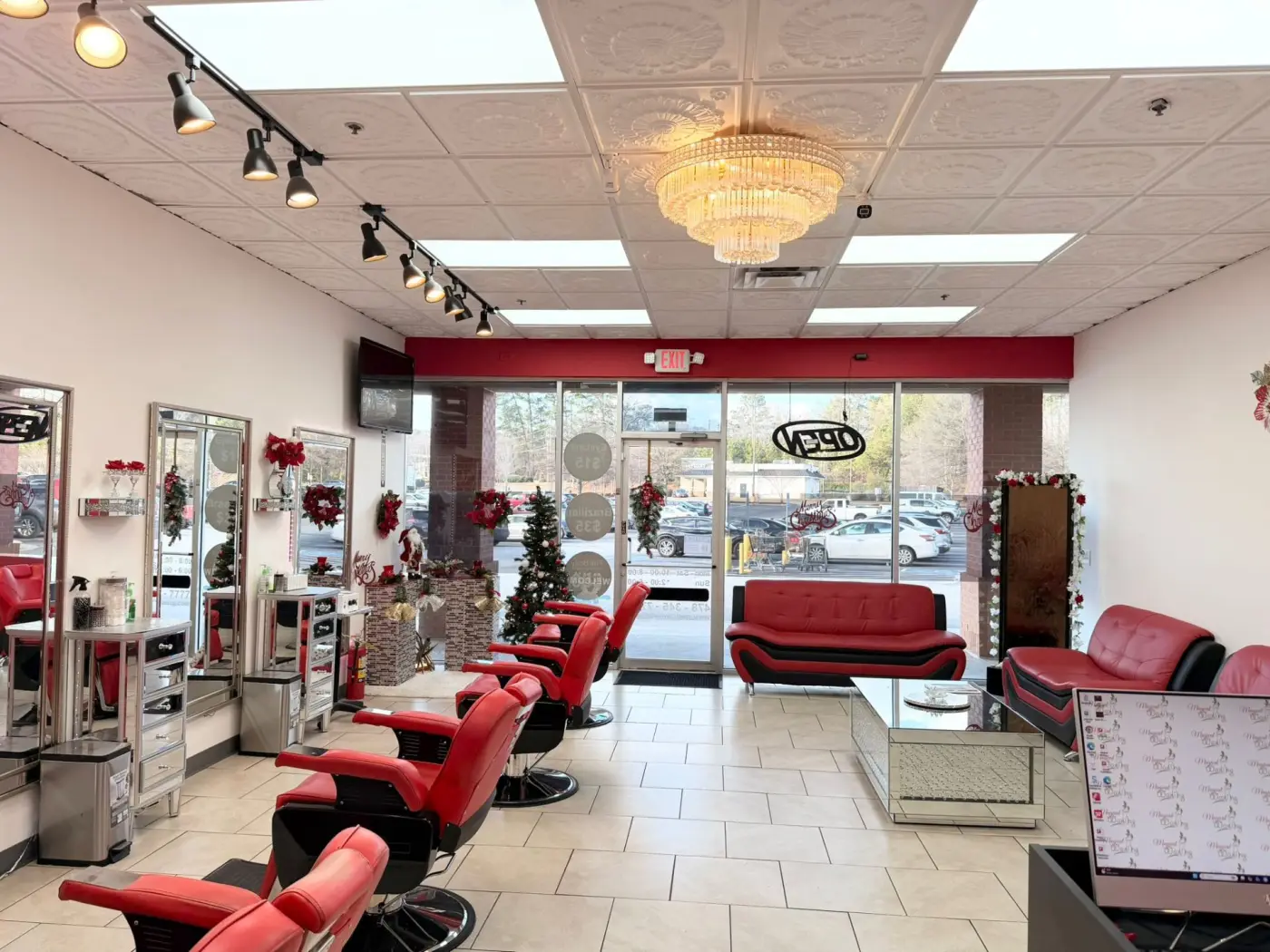 Reception lobby with chandelier at a Magical Waxing® studio in metro Atlanta